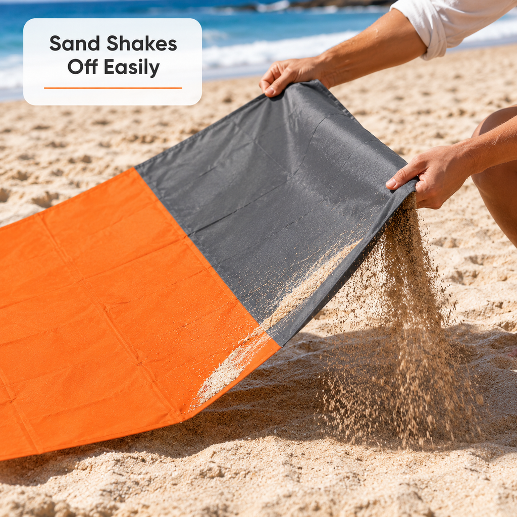 SandAway orange beach blanket spread on sandy beach